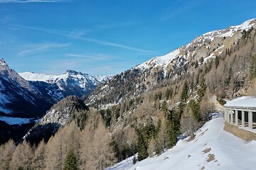 Image showing aerial snow covered mountain peaks in alps at winter 