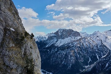 Image showing aerial snow covered mountain peaks in alps at winter 