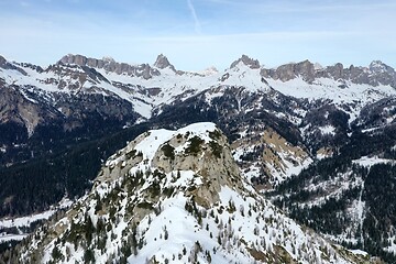 Image showing aerial snow covered mountain peaks in alps at winter 