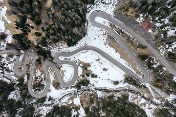 Image showing alpine curvy road on winter top view