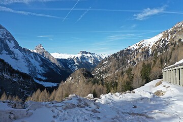 Image showing aerial snow covered mountain peaks in alps at winter 