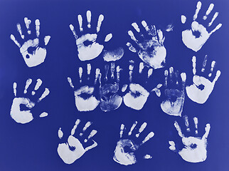 Image showing creative children black handprints painting