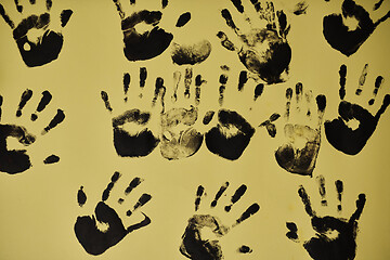 Image showing creative children black handprints painting