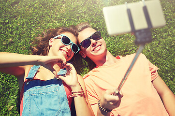 Image showing happy couple taking selfie on smartphone at summer