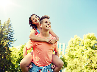 Image showing happy teenage couple having fun at summer park