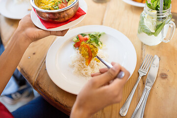 Image showing woman eating at restaurant