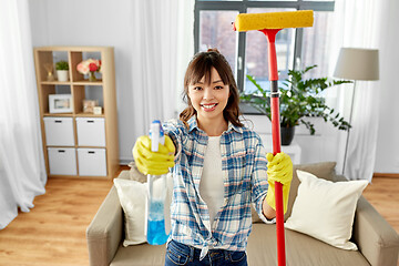 Image showing asian woman with window cleaner and sponge mop