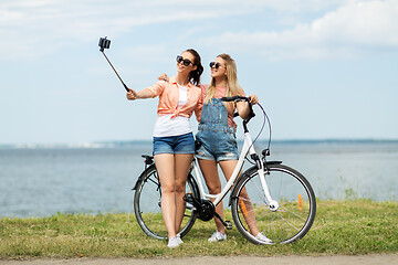 Image showing teenage girls with bicycle taking selfie in summer