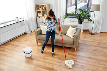 Image showing woman or housewife with mop cleaning floor at home