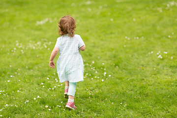 Image showing happy little baby girl running at park in summer