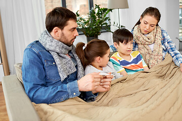 Image showing family with ill children having fever at home