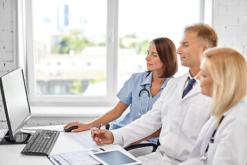 Image showing group of doctors with computer at hospital