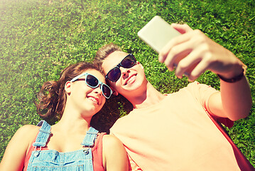 Image showing happy couple taking selfie on smartphone at summer