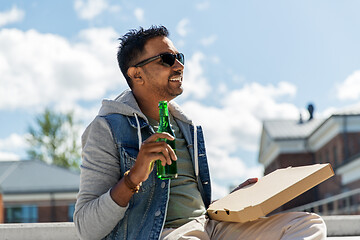 Image showing indian man with pizza and drinking beer outdoors
