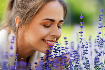 Image showing close up of woman smelling lavender flowers