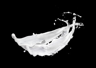 Image showing Floating fresh milk or yoghurt splashing with drops against black background.