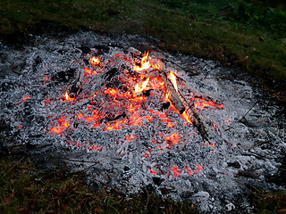 Image showing Glowing embers of burning wood log fire