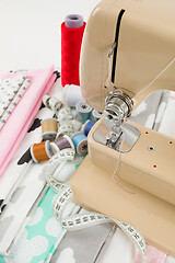 Image showing Sewing machine, fabric and measurement tape