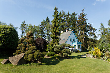 Image showing Beautiful rural house in spring garden