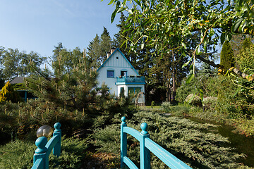 Image showing Beautiful rural house in spring garden