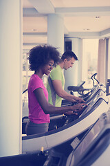 Image showing people exercisinng a cardio on treadmill in gym