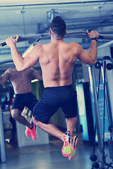 Image showing handsome man exercising at the gym