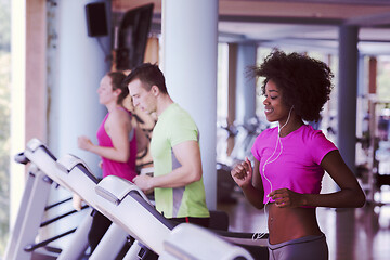 Image showing people exercisinng a cardio on treadmill in gym