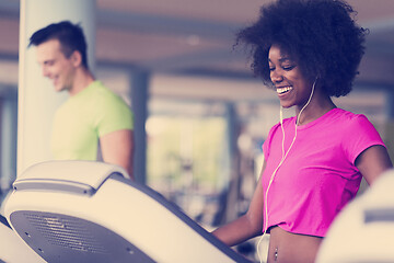 Image showing people exercisinng a cardio on treadmill