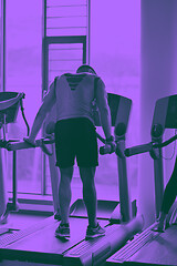 Image showing man running on the treadmill