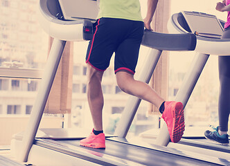 Image showing people exercisinng a cardio on treadmill in gym