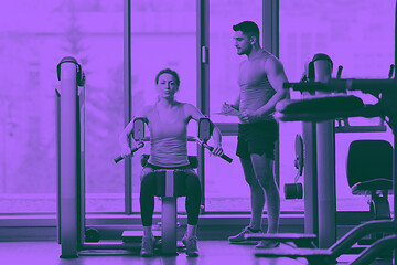 Image showing woman exercising with her personal trainer