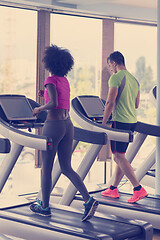Image showing people exercisinng a cardio on treadmill