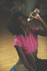 Image showing young afro american woman in gym have pilates workout break