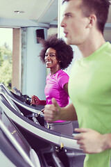 Image showing people exercisinng a cardio on treadmill in gym