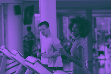 Image showing people exercisinng a cardio on treadmill