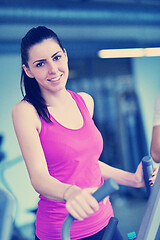 Image showing woman exercising on treadmill in gym