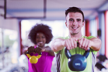 Image showing couple  workout with weights at  crossfit gym