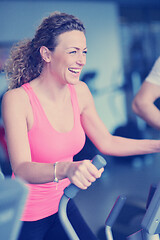 Image showing woman exercising on treadmill in gym