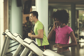 Image showing people exercisinng a cardio on treadmill