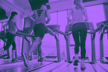 Image showing woman exercising on treadmill in gym