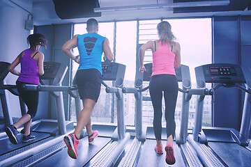 Image showing woman exercising on treadmill in gym