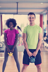 Image showing couple  workout with weights at  crossfit gym