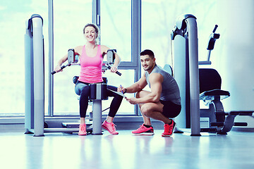 Image showing woman exercising with her personal trainer