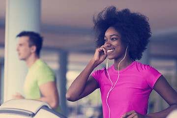 Image showing people exercisinng a cardio on treadmill