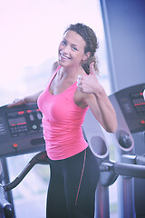 Image showing woman exercising on treadmill in gym