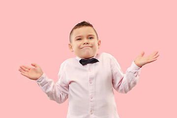 Image showing Beautiful teen boy looking suprised and bewildered isolated on pink