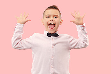 Image showing Winning success boy happy ecstatic celebrating being a winner. Dynamic energetic image of male model