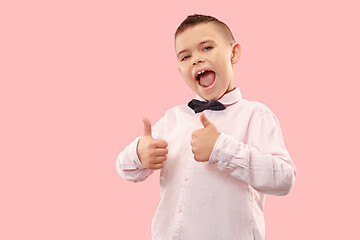 Image showing Isolated on pink young casual boy shouting at studio