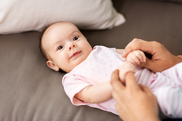 Image showing middle aged father playing with baby at home