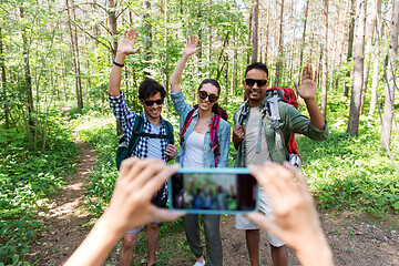 Image showing friends with backpacks being photographed on hike